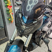 PROTECTOR DE FAROLA EN ACERO BAJAJ DOMINAR 250 - 400 UG