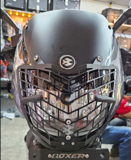 PROTECTOR DE FAROLA EN ACERO BAJAJ BOXER CT