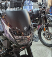 PROTECTOR DE FAROLA EN ACERO BAJAJ BOXER CT