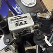 PROTECTOR DE BOMBA O DEPOSITO DE LIQUIDO DE FRENO DELANTERO TVS RAIDER
