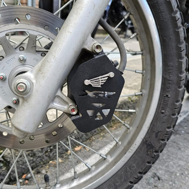 PROTECTOR DE CALIPER EN ACERO HONDA XR150 - XR190L