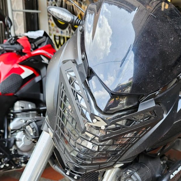 PROTECTOR DE FAROLA EN ACERO BAJAJ DOMINAR 250 - 400 UG
