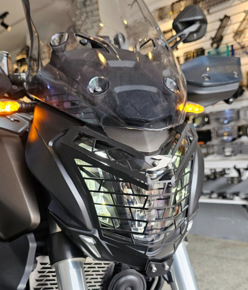 PROTECTOR DE FAROLA EN ACERO BAJAJ DOMINAR 250 - 400 UG